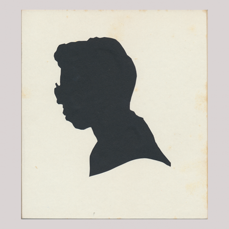 
        Front of silhouette, with man looking left, wearing glasses.